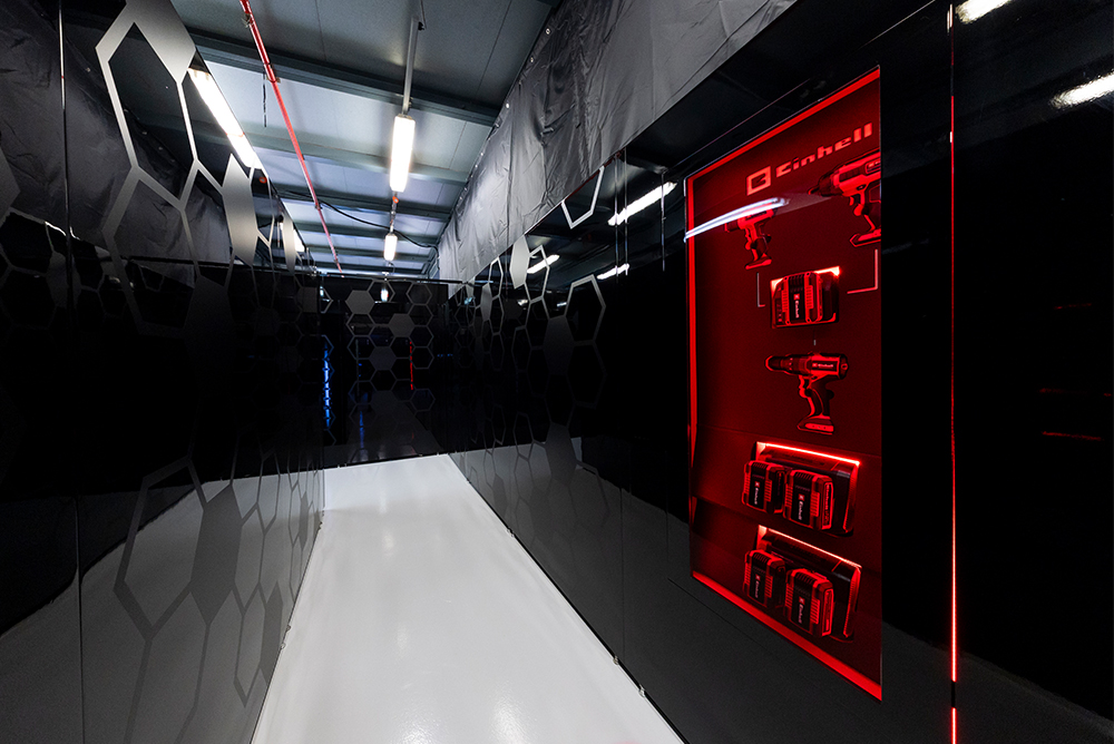 Modern exhibition area with Einhell logo inside a building.